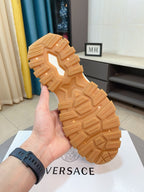 Versace sneaker outsole, tan rubber tread with deep grooves