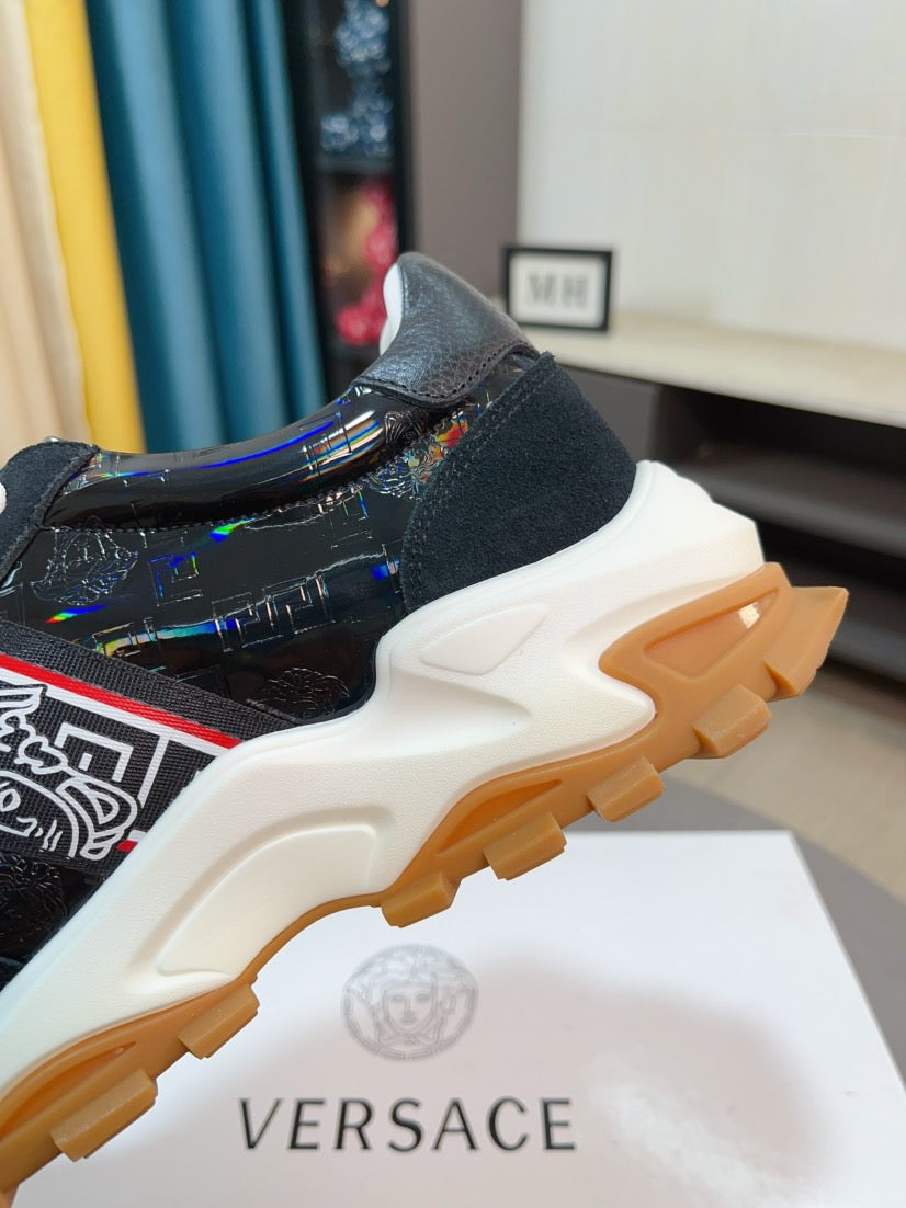 Versace lace-up sneaker, side view with black glossy upper and chunky tread outsole