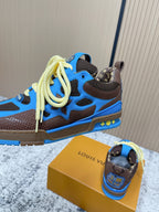 Unisex sneakers side view with blue upper, dark brown sole, and neon yellow laces