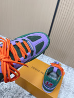 Louis Vuitton unisex sneaker side, purple upper, green mesh, orange laces.