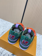 Louis Vuitton unisex sneakers with green heels, purple collars, orange laces.