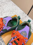 Louis Vuitton unisex sneakers showing green lining, purple panels, orange laces.