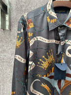 Long-sleeve button-up shirt with dark blue ground and colorful animal and chain motifs.