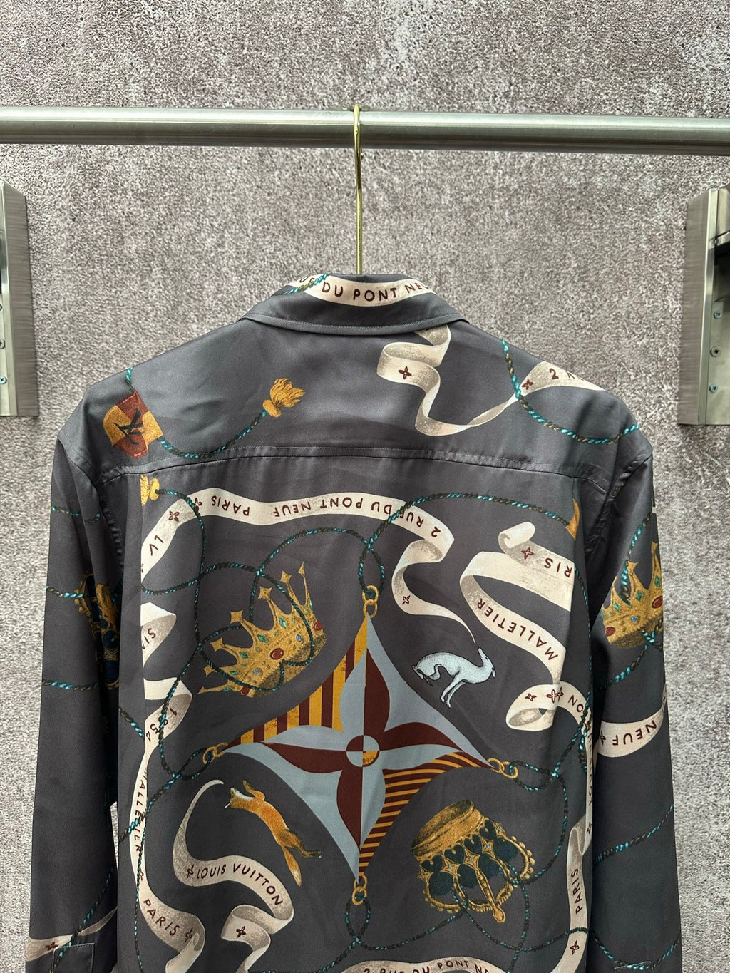 Long-sleeve button-up shirt back view with dark blue chain and animal graphic print.