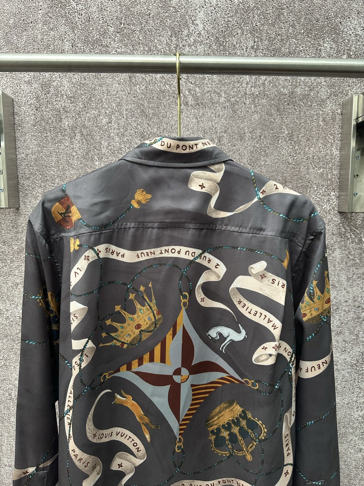 Long-sleeve button-up shirt back view with dark blue chain and animal graphic print.