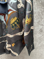 Long-sleeve button-up shirt sleeve and side panel with colorful chain and animal graphic.