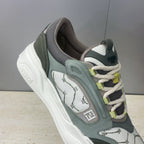 Fendi unisex sneakers, close-up side profile with patterned panels and lime-green lace accents