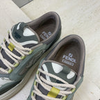 Fendi unisex sneakers, close-up of tongue and heel with "FENDI" logo and white laces