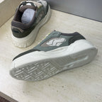 Fendi unisex sneakers, heel and outsole view with textured tread and dark upper