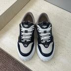 Fendi unisex sneakers in navy and off-white with white laces and logo patches