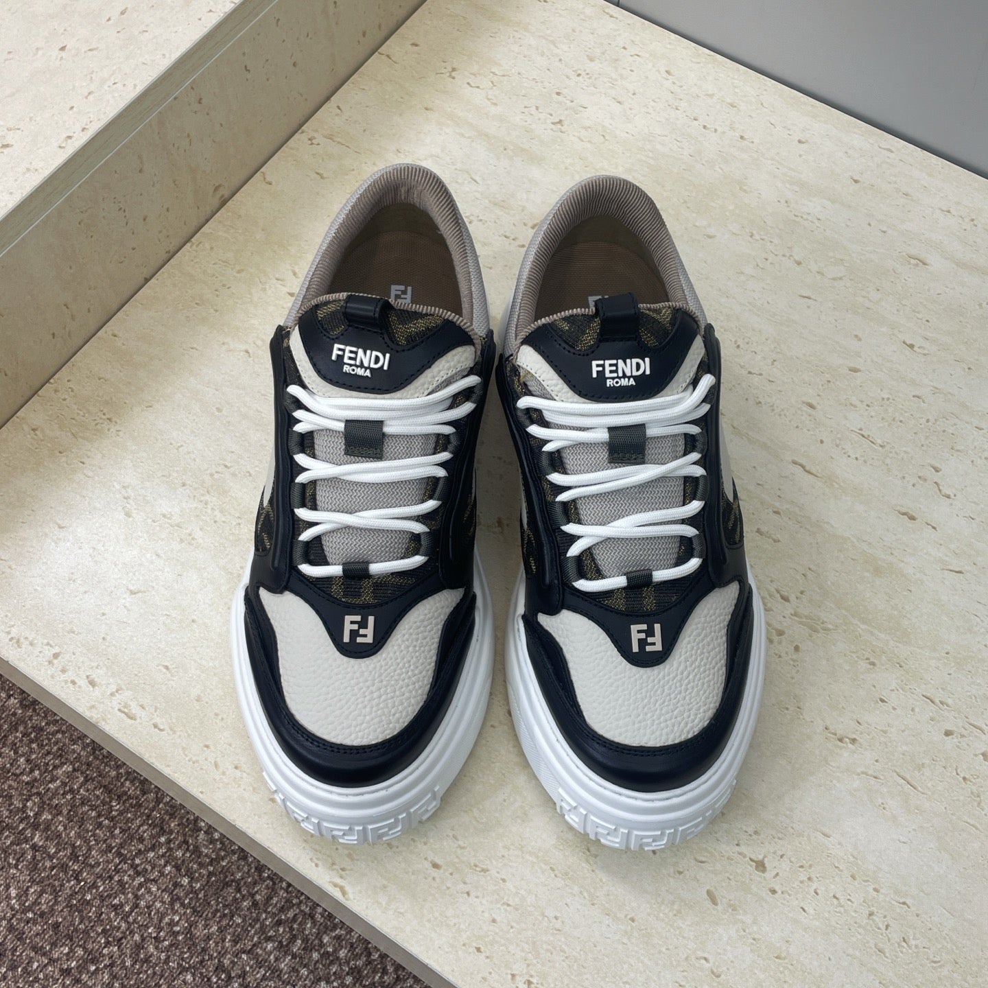 Fendi unisex sneakers in navy and off-white with white laces and logo patches
