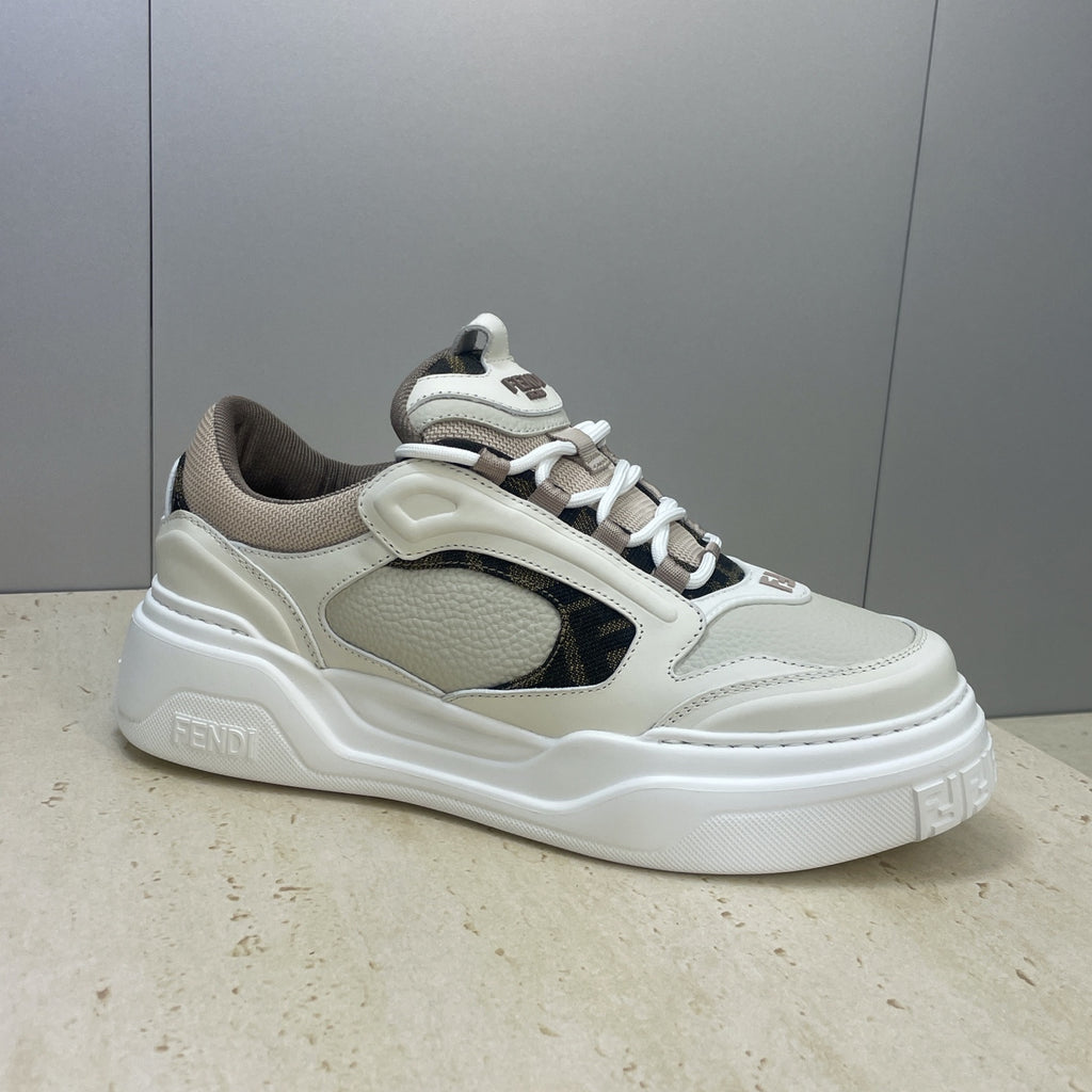 Fendi unisex sneakers side view: white upper, dark oval side panel, lace-up and platform sole.