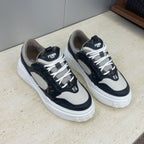 Fendi unisex sneakers shown from above, navy and off-white with white lace-up front