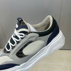 Fendi unisex sneakers close-up, light gray uppers with navy stripe and white laces