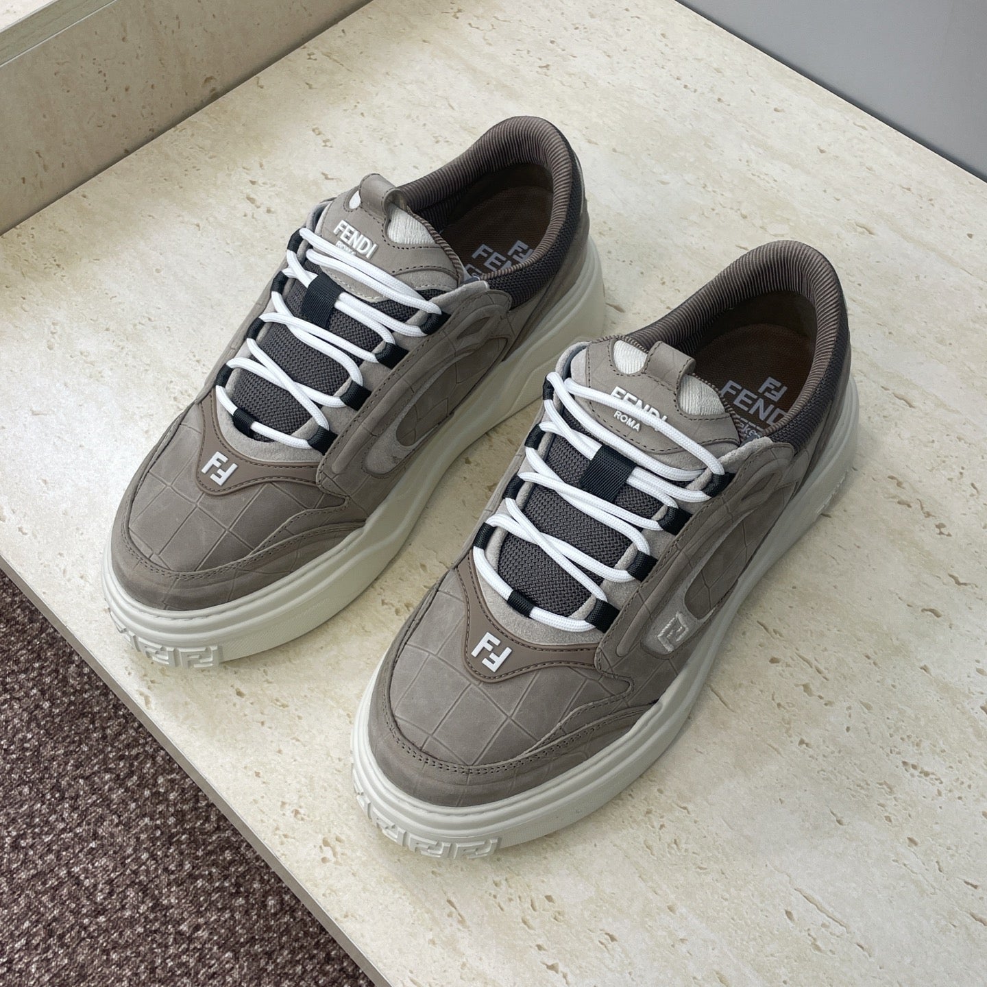 Fendi unisex sneakers, gray-taupe leather, white laces, F logo detail near tongue