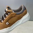 Close-up of tan Fendi unisex sneaker side with gray collar and white sole detailing