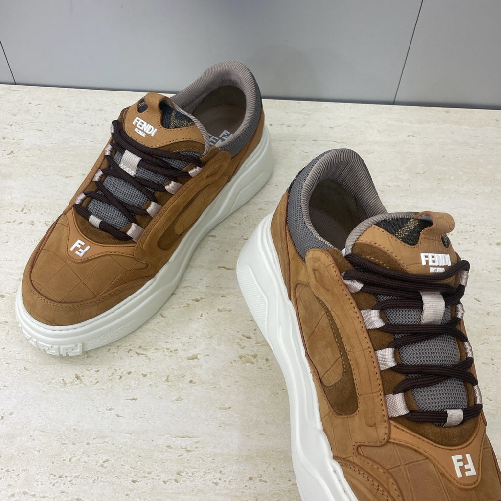 Tan Fendi unisex sneakers with gray collar, lace-up front, and white cushioned sole