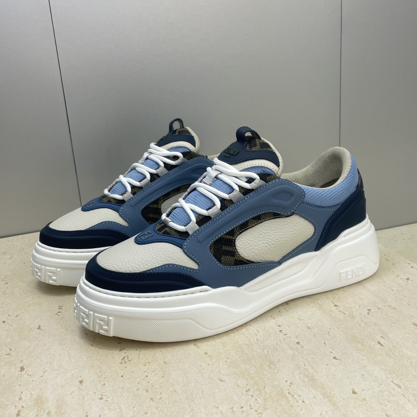Fendi unisex sneakers front view, navy toe and heel, light blue overlays, white sole
