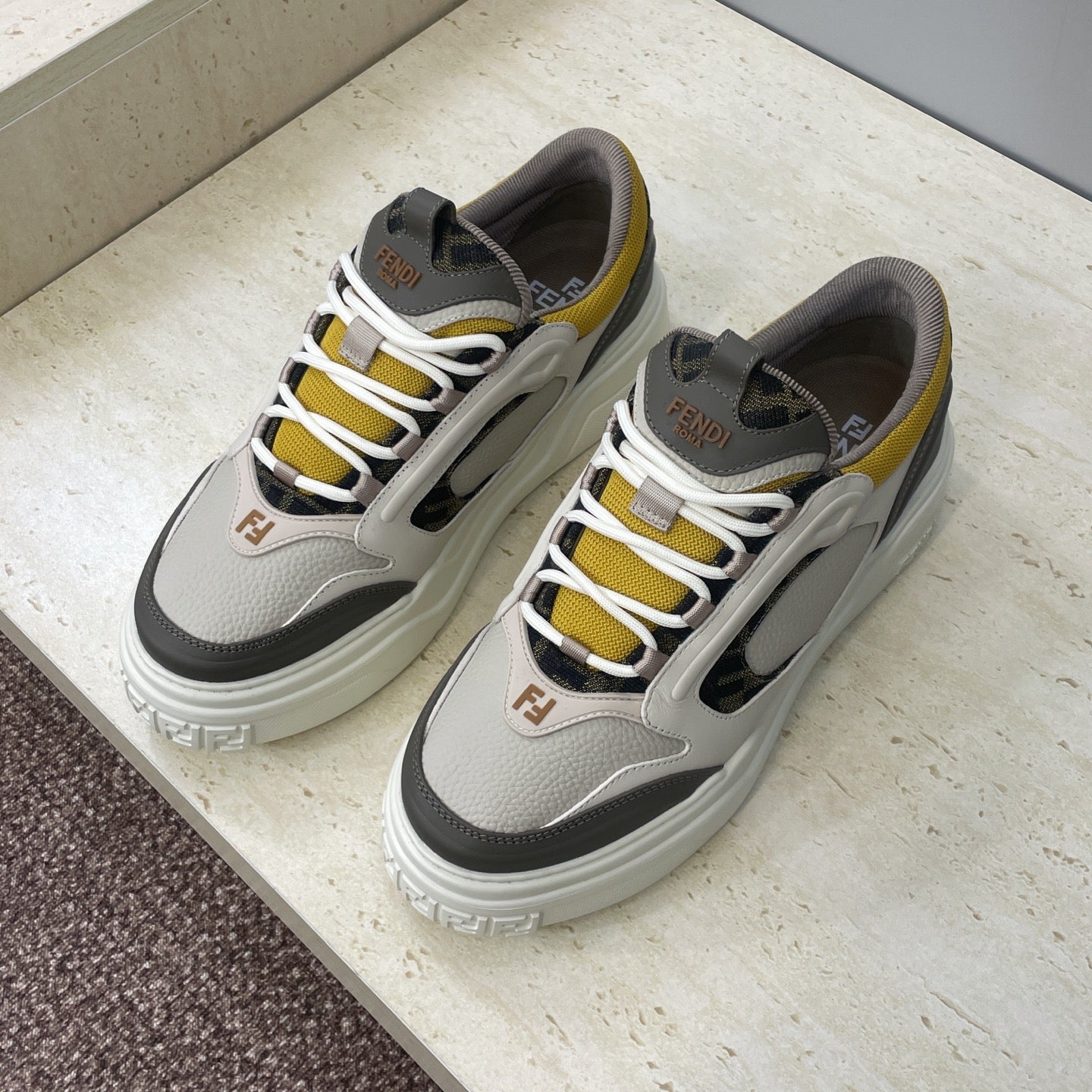 Fendi unisex sneakers, light gray uppers with white laces, yellow stripe and black panels