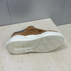 Tan Fendi unisex sneaker outsole view with white tread and gray heel panel