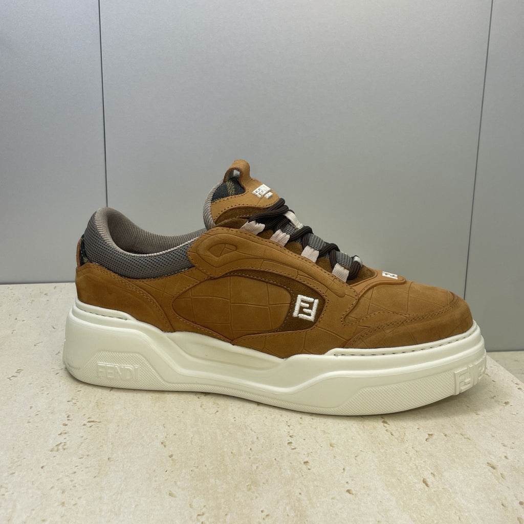 Tan Fendi unisex sneaker with gray collar, lace-up design, and white midsole
