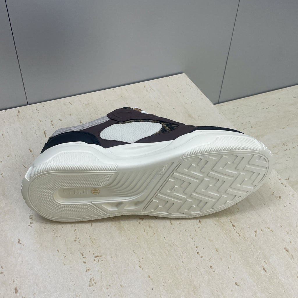 Unisex sneaker outsole view, textured tread on cream rubber sole