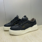 Fendi unisex sneakers, navy uppers with gold monogram patch and cream white sole