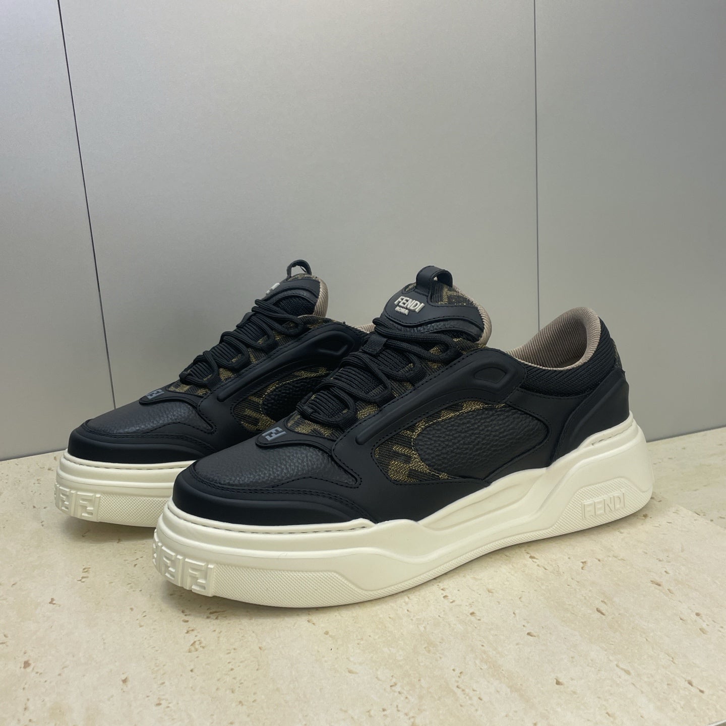 Fendi unisex sneakers, navy uppers with gold monogram patch and cream white sole
