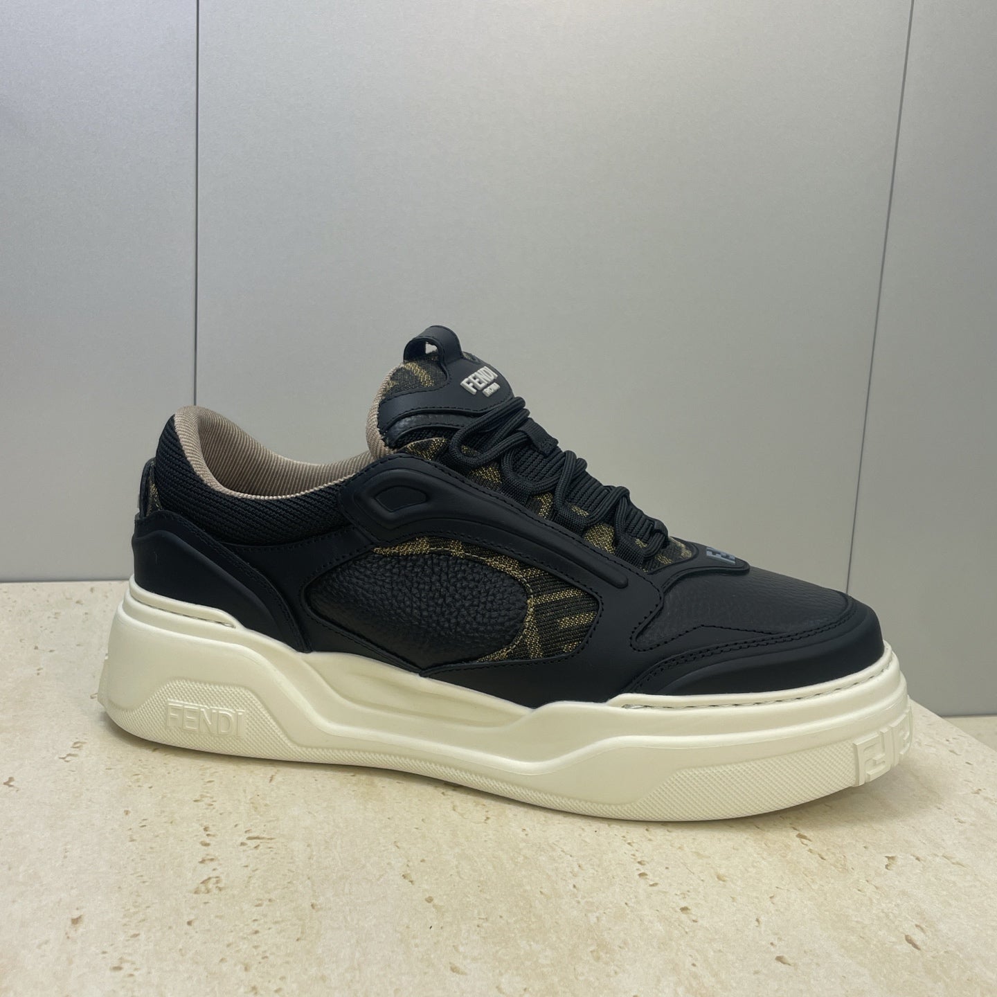 Fendi unisex sneakers, dark navy with gold logo patch and chunky cream-white sole