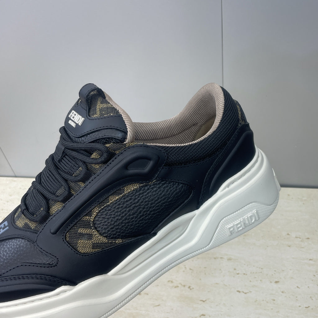 Fendi unisex sneakers close-up: navy leather, gold logo panel, white platform sole
