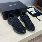 Chanel unisex low-top sneakers in dark fabric with CC logo detail and lace-up front