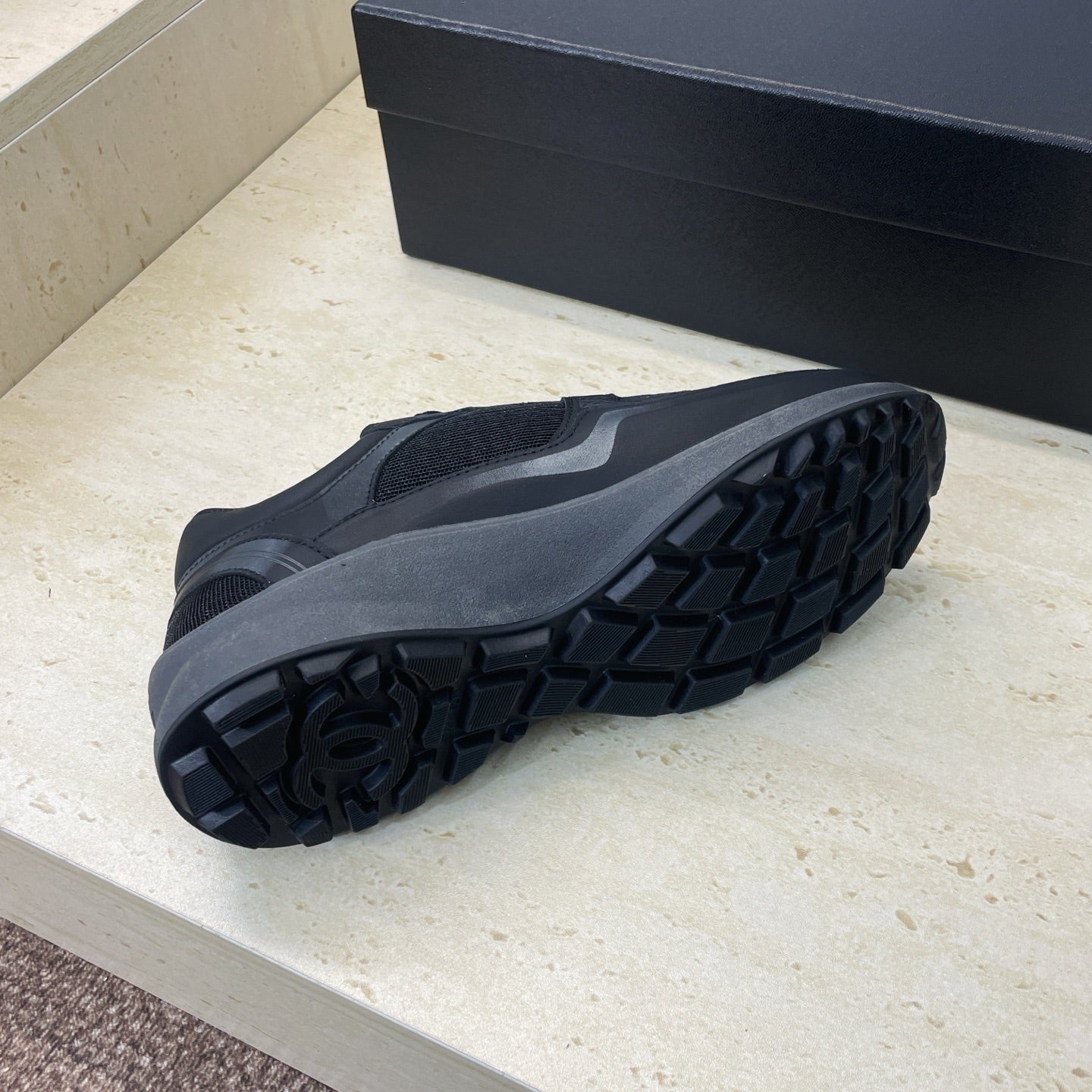 Chanel unisex sneaker outsole with tread pattern and dark rubber sole