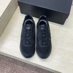 Chanel unisex low-top sneakers, dark upper with lace-up closure and cushioned sole