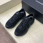 Chanel unisex low-top sneakers in dark mesh with lace-up front and rubber sole