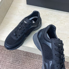 Chanel unisex low-top sneakers with dark mesh and leather panels, lace-up design