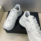 White Chanel unisex lace-up sneakers, toe and quarter detail with laces