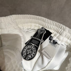 White Chrome pants folded with elastic waistband and product tag