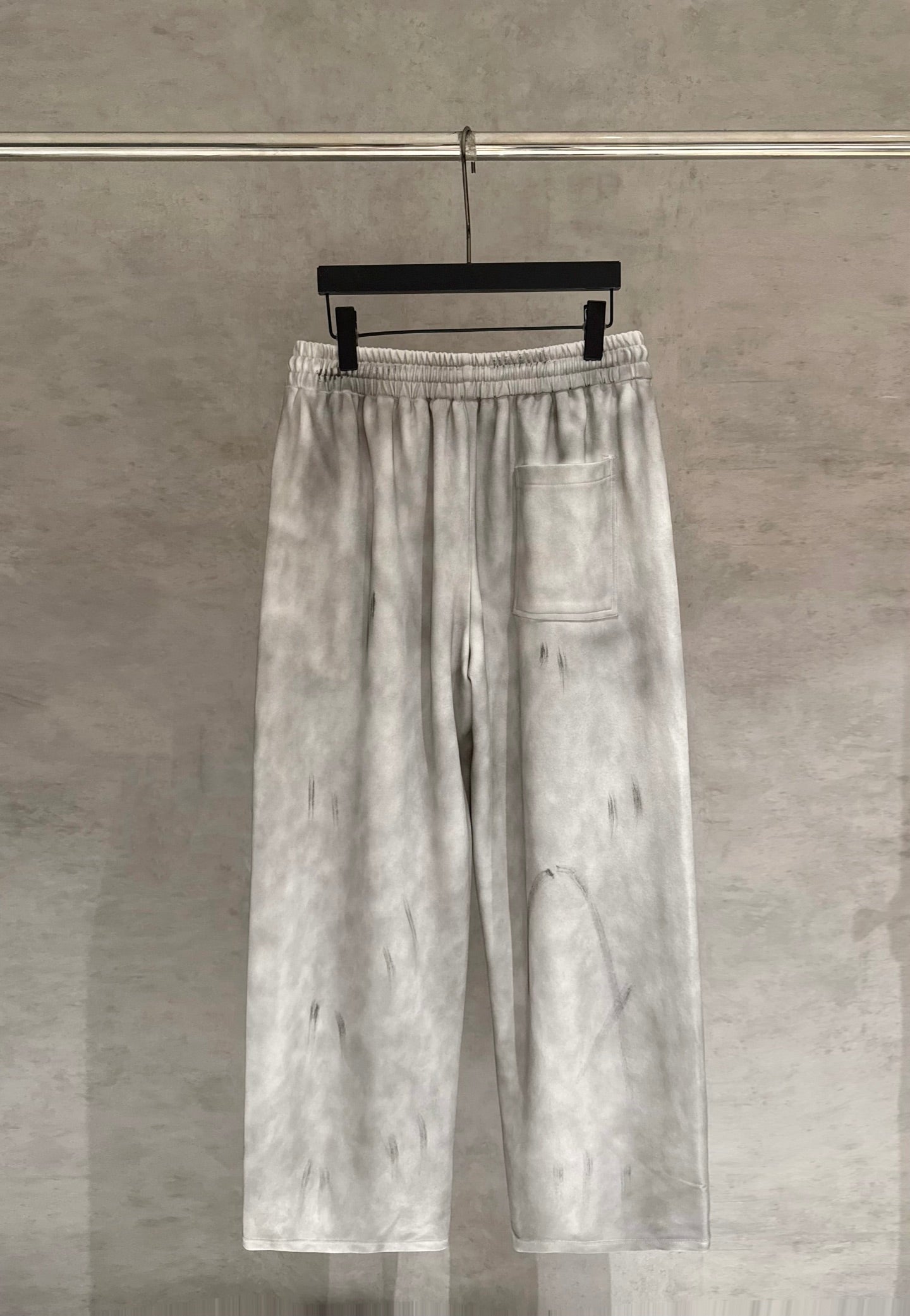 Light gray Chrome pants with elastic waist, white drawstrings, and side pocket