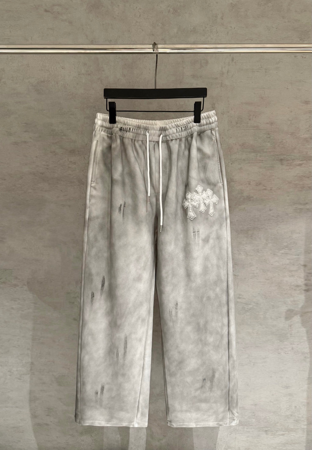 Light gray Chrome pants with elastic waistband and white drawstring ties