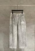 Light gray Chrome pants with elastic waistband and white drawstring ties