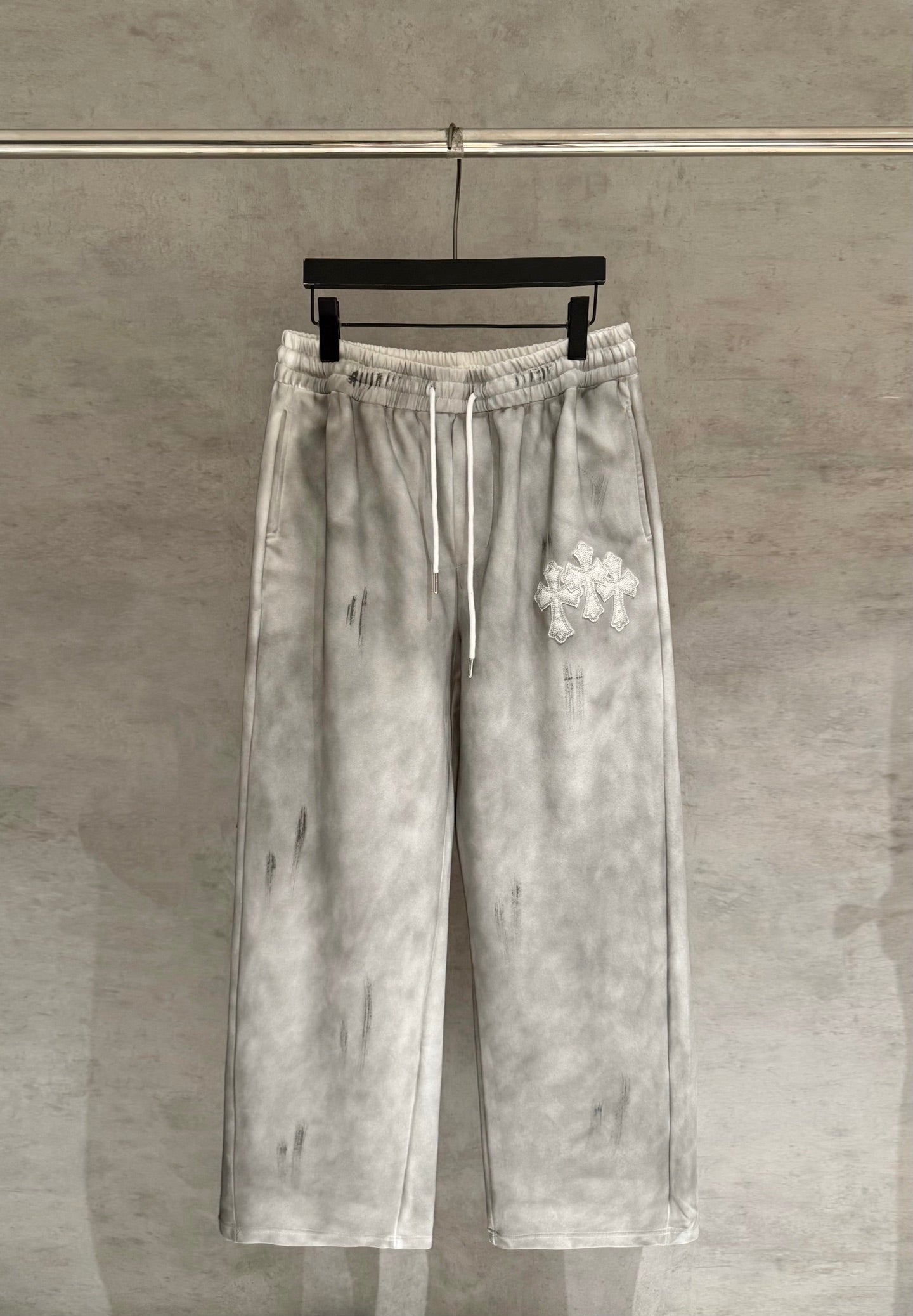 Light gray Chrome pants with elastic waistband and white drawstring ties