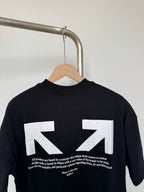 Black T-shirt back with white arrows and small text below