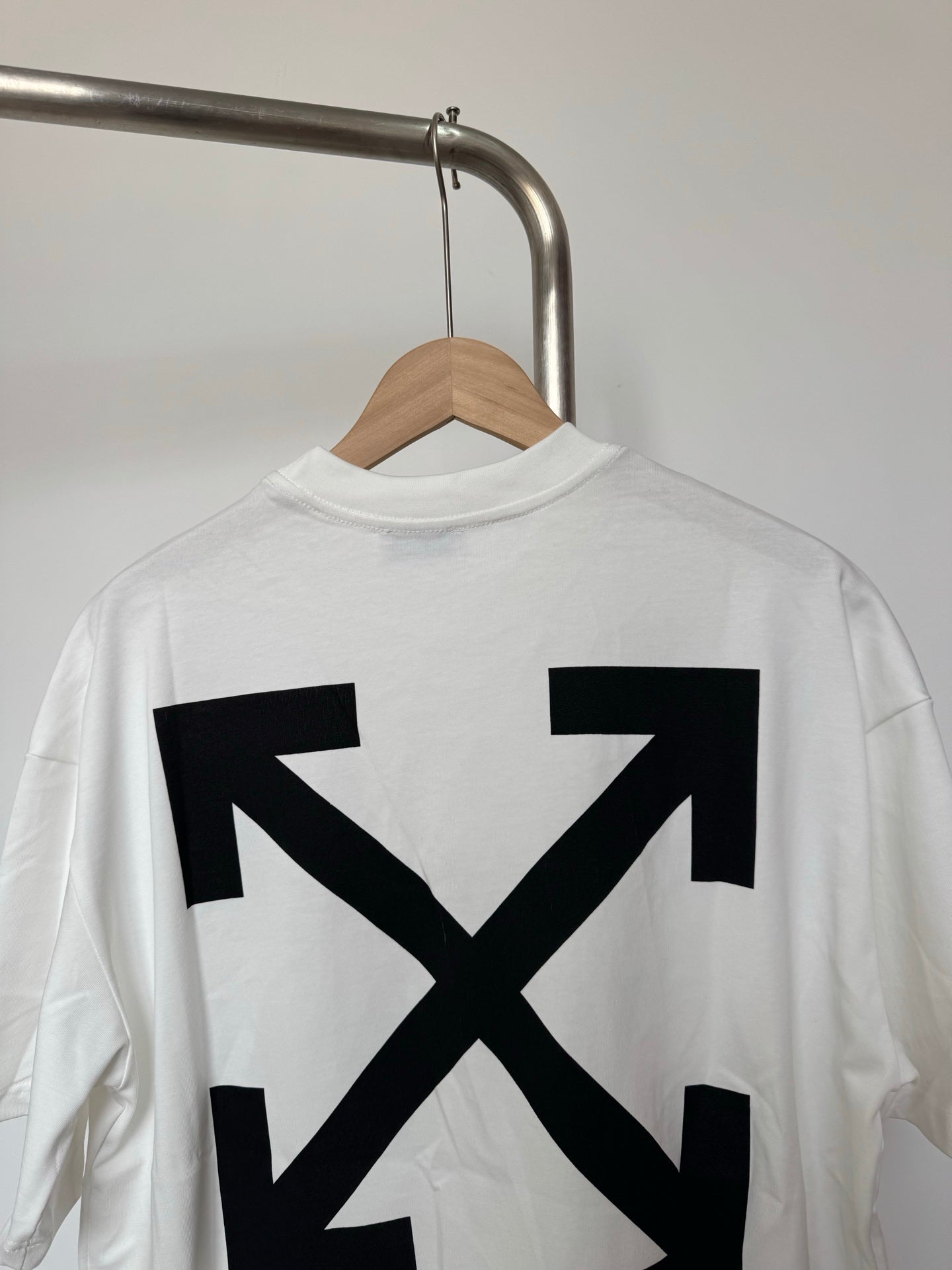 Off White T-shirt back close-up of black arrow X graphic