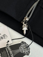 Black hoodie cuff with ribbed knit and silver zipper pull with charm