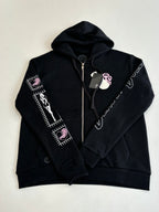 Black zip-up hoodie with hood, front zipper, and sleeve graphic stripes in white and pink
