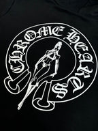 Black hoodie with large white oval graphic print and sword-themed illustration