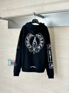 Black zip-up hoodie with hood and large white graphic print on chest, sleeve logos