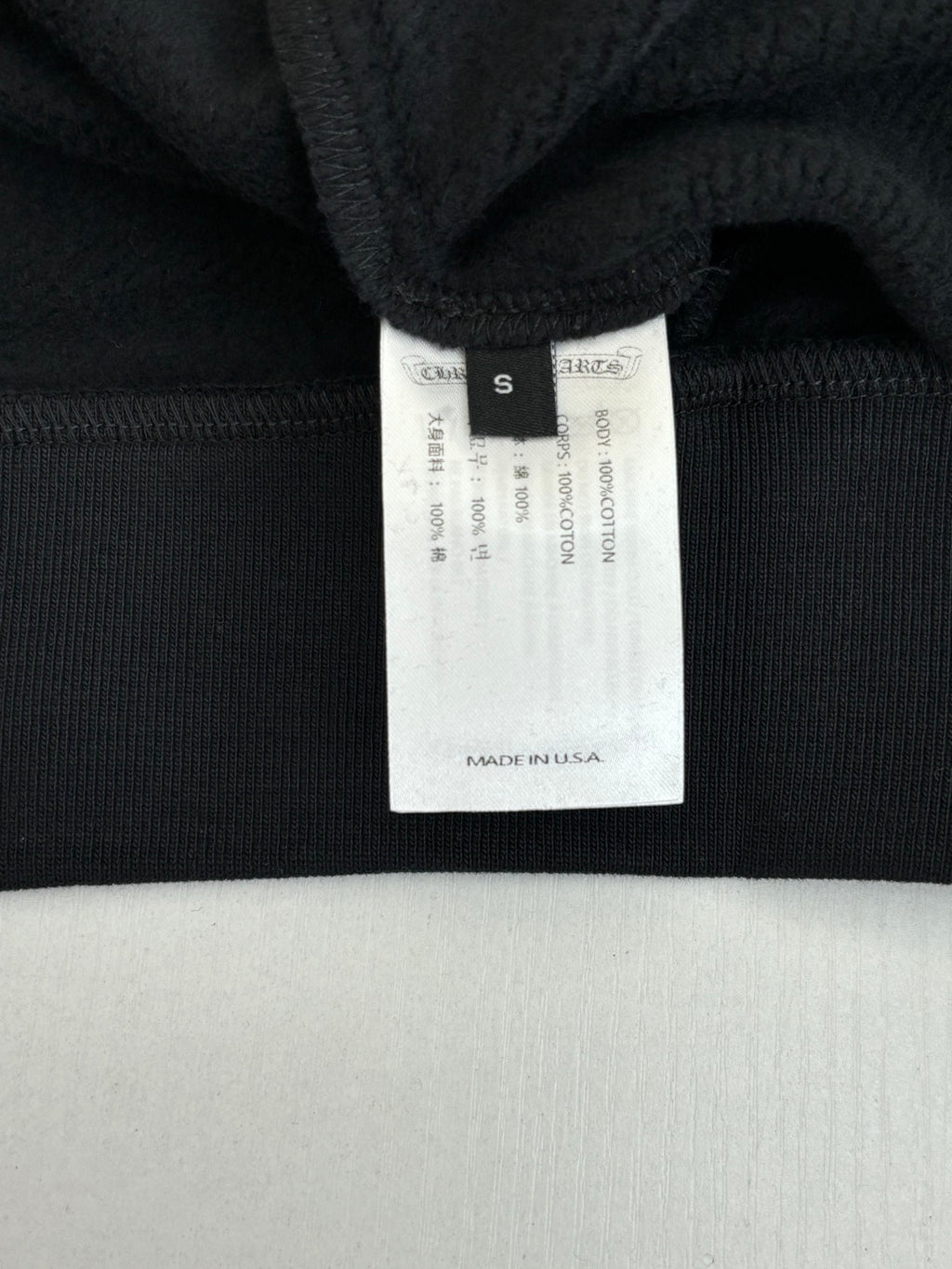 Black long-sleeve top neck label with size S