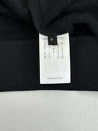 Black long-sleeve top neck label with size S