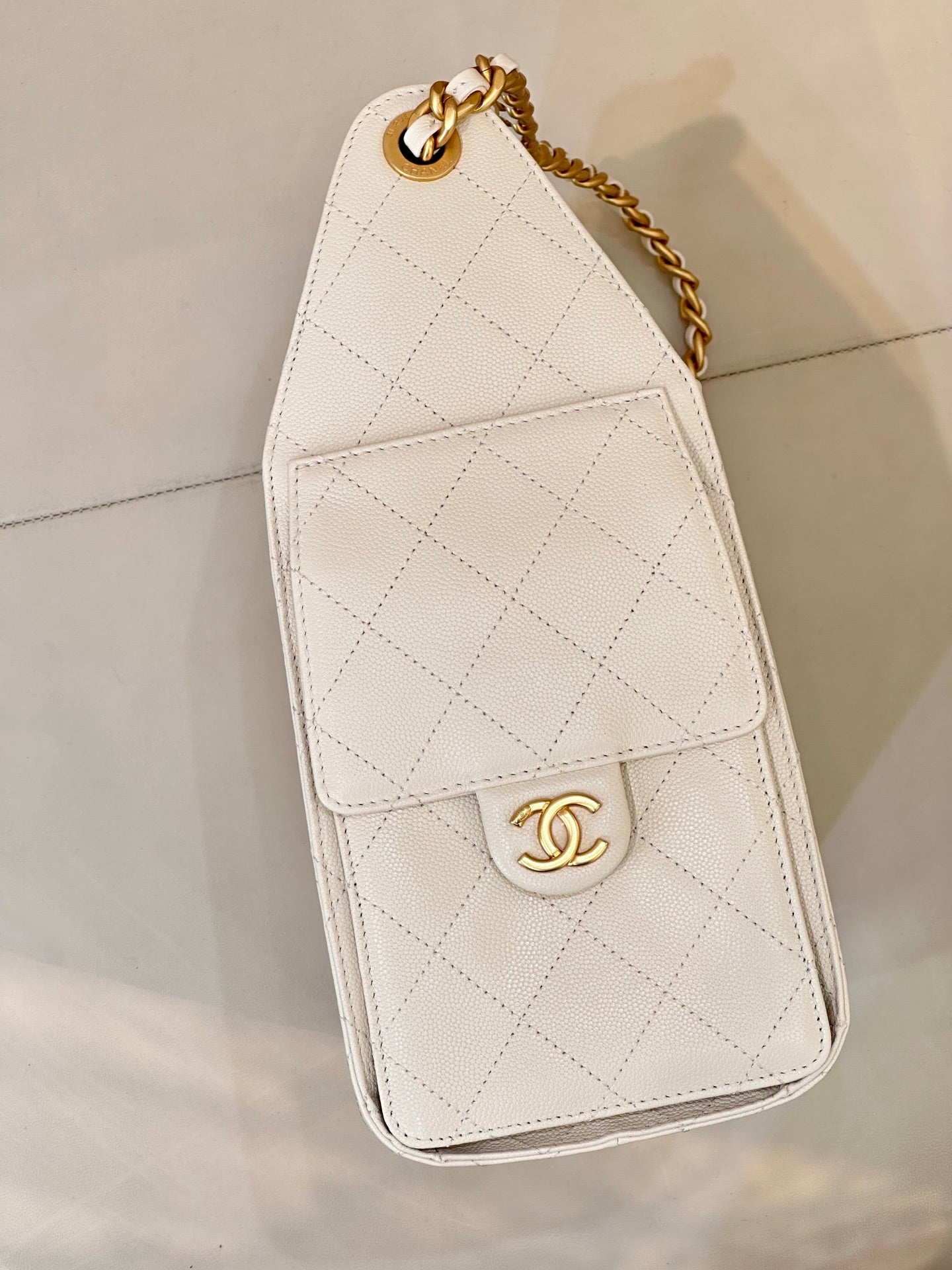 Chanel quilted white leather mini flap bag with gold chain handle and CC logo